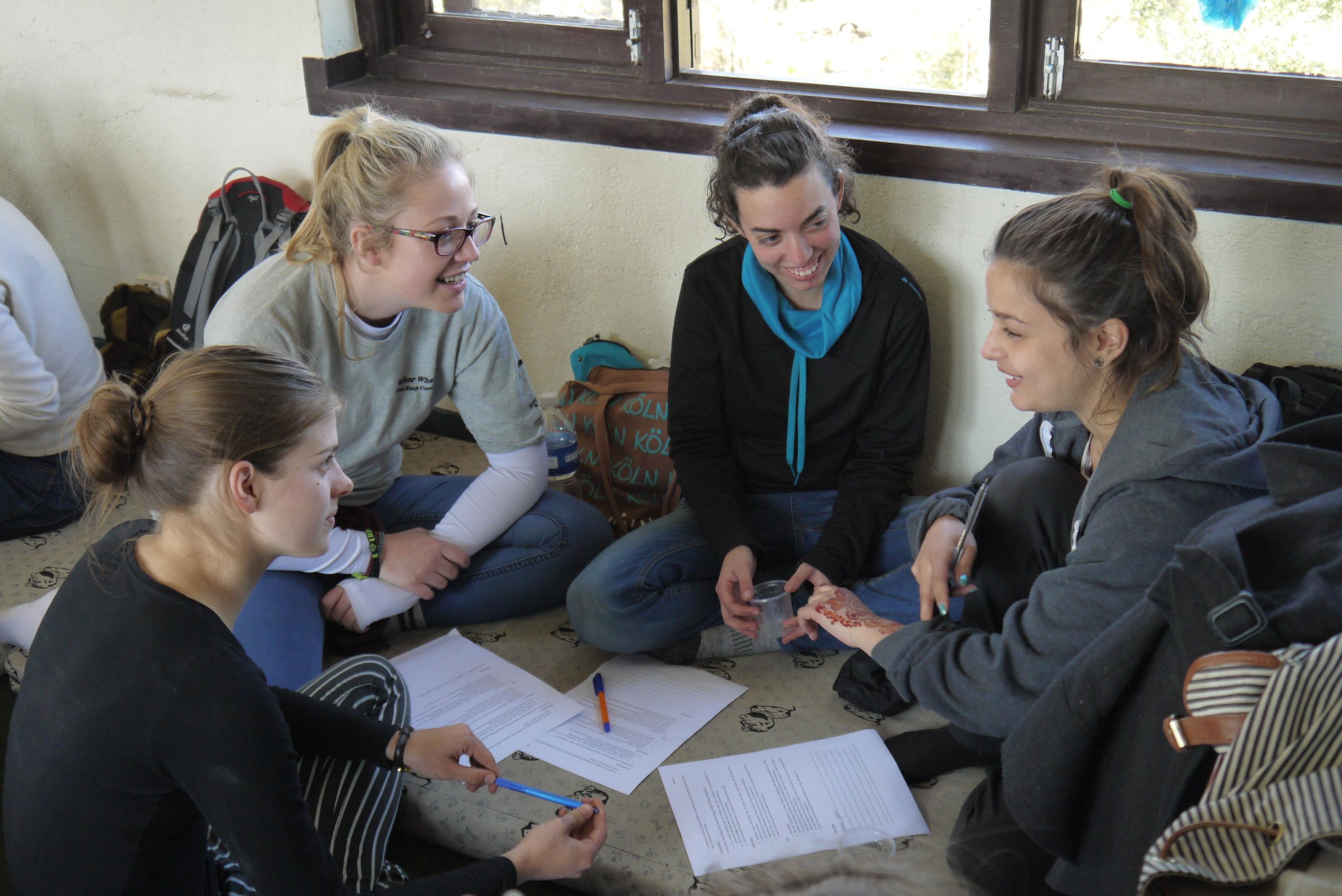 Female Childcare HIV/Aids volunteers prepare an educational activity in Nepal. Projects Abroad female Care HIV/Aids volunteers working in Nepal prepare an educational activity.